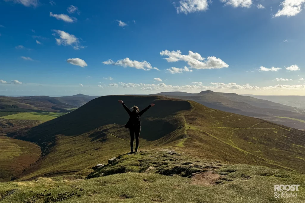 Black Mountains Wales  a girl enjoying the peak of mountain.