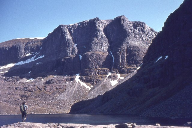 a girl standing near the lack in Beinn Eighe